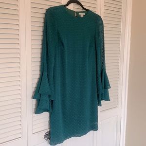 Deep green textured dress with ruffle sleeves
